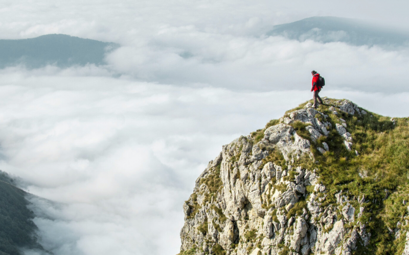 someone climbing a large mountain