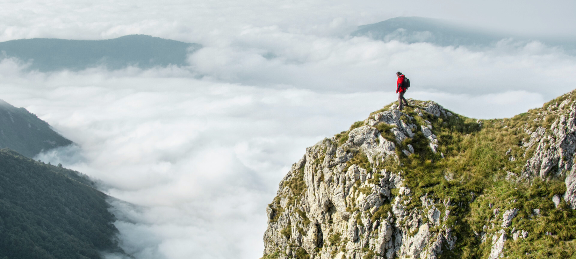 someone climbing a large mountain